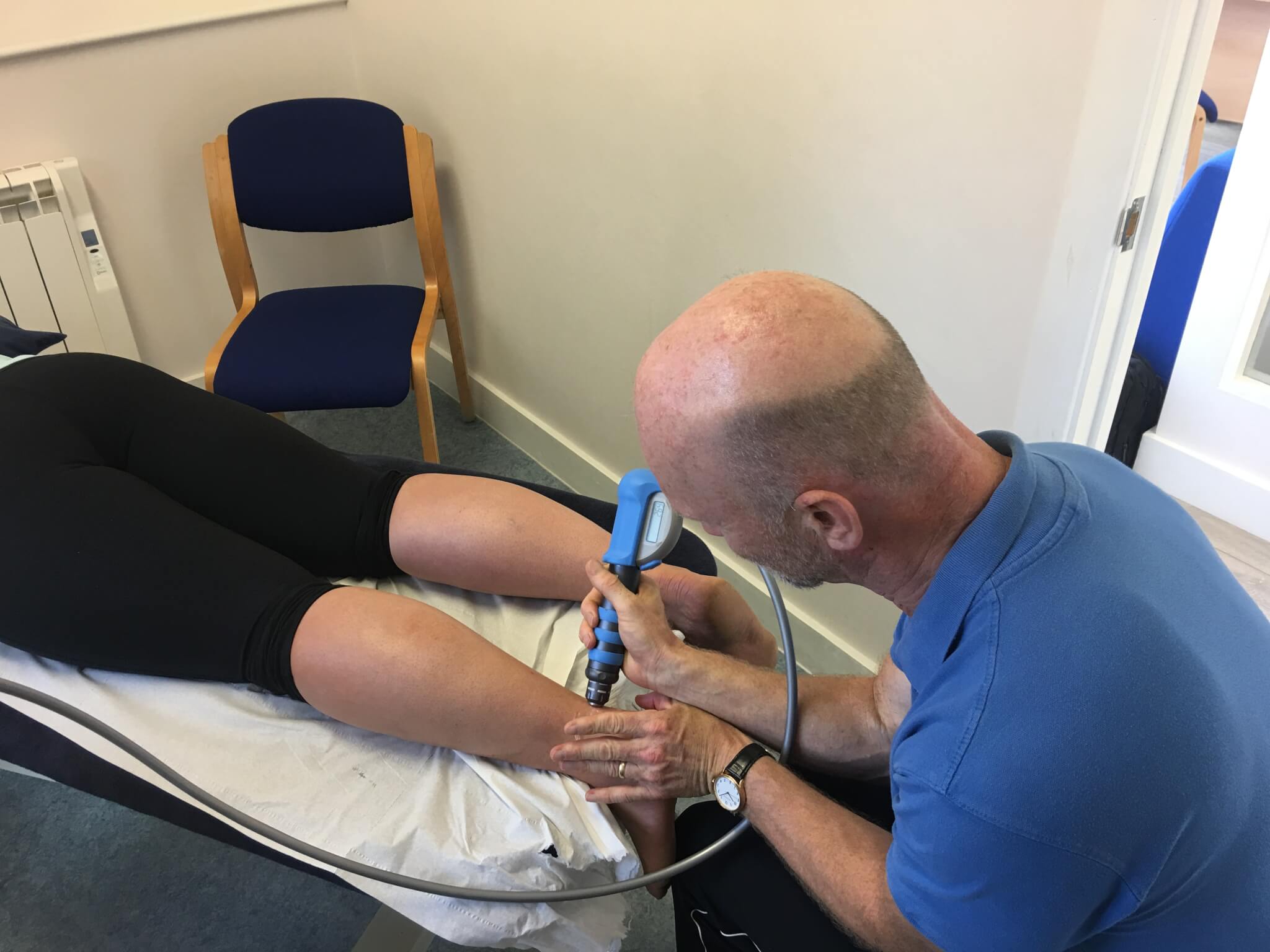 IMG_3613 Patient receiving Shockwave Therapy treatment for a tendon injury