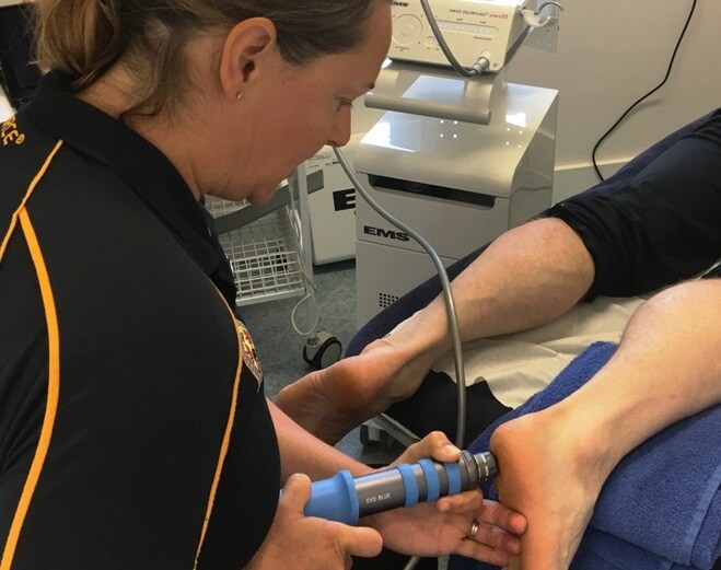 shockwave-therapy-small Patient receiving shockwave therapy for heel pain